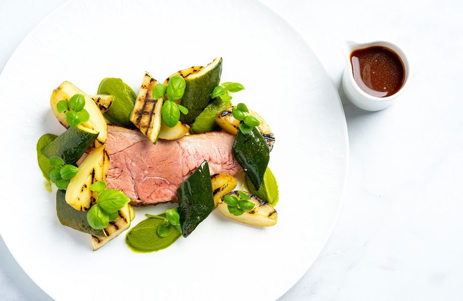 Roasted lamb rump, courgette, grilled potatoes and vegetable demi-glace