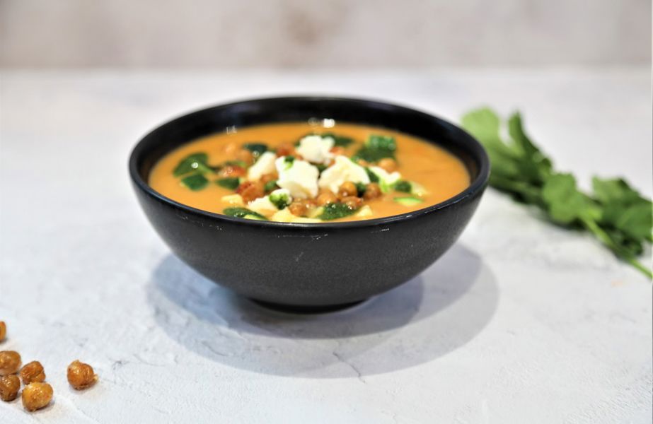 Spiced vegetable soup with herb oil