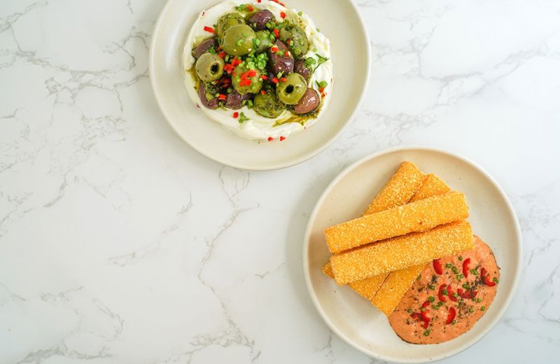 Green harissa olives with labneh
