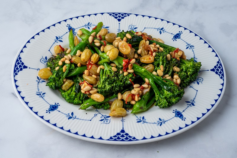 Grilled broccoli, golden raisins, pine nuts and chilli oil